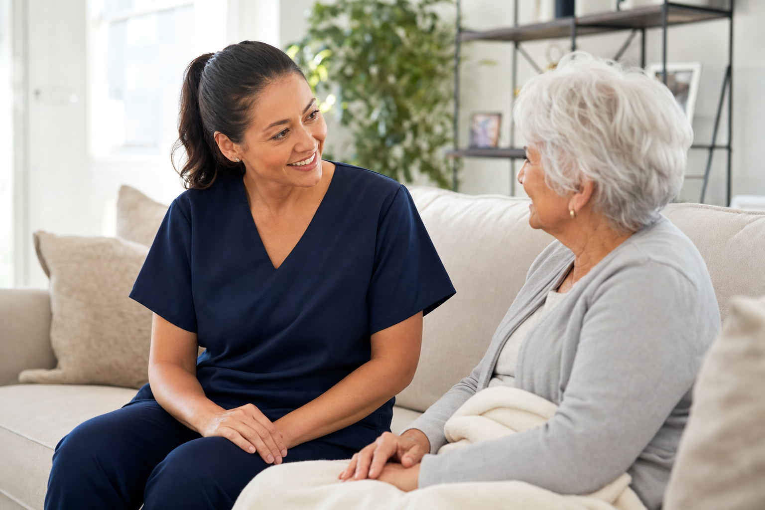 Caregiver and client at home — real care, supported by AI.